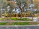 Well-maintained home with mature trees, desert landscaping, and a brick driveway at 9 Quail Run Rd, Henderson, NV 89014