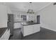 Well-appointed kitchen with granite countertops, stainless steel appliances, white cabinets, and a functional central island at 9 Quail Run Rd, Henderson, NV 89014