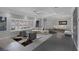 Open-concept living space with contemporary furnishings and neutral color palette at 9 Quail Run Rd, Henderson, NV 89014