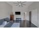 Spacious living room with dark floors, neutral walls, gray sofa, and a tall ceiling with a modern ceiling fan at 9 Quail Run Rd, Henderson, NV 89014