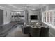 Open-concept floor plan combining the wet bar, living room, and dining area at 9 Quail Run Rd, Henderson, NV 89014