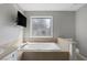 Large main bathroom offering a luxurious soaking tub, natural light, and privacy at 9 Quail Run Rd, Henderson, NV 89014