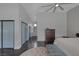 Long main bedroom showcasing hardwood floors, sliding closets, and ensuite bath at 9 Quail Run Rd, Henderson, NV 89014