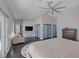 Spacious main bedroom featuring private outdoor access, a ceiling fan, and ample closet space at 9 Quail Run Rd, Henderson, NV 89014
