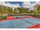 Well-maintained tennis courts surrounded by mature trees, perfect for an active lifestyle at 9 Quail Run Rd, Henderson, NV 89014