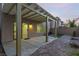 Inviting backyard patio with covered pergola, desert landscaping, and beautiful brick pavers at 9006 Cedar Door Ave, Las Vegas, NV 89148