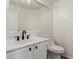 Powder room featuring a modern sink, vanity with dark hardware and toilet at 9006 Cedar Door Ave, Las Vegas, NV 89148