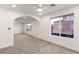 Expansive bedroom with neutral carpet, ceiling fan, adjoining sitting area and large window at 9006 Cedar Door Ave, Las Vegas, NV 89148