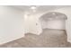 Large bedroom with neutral carpet, ceiling fan, and adjoining sitting area at 9006 Cedar Door Ave, Las Vegas, NV 89148