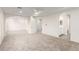 Expansive bedroom with neutral carpet, ceiling fan, and adjoining sitting area at 9006 Cedar Door Ave, Las Vegas, NV 89148