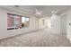 Large bedroom with neutral carpet, ceiling fan and plenty of windows at 9006 Cedar Door Ave, Las Vegas, NV 89148