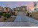 Inviting two-story home featuring a well-maintained front yard and a spacious two-car garage at 9006 Cedar Door Ave, Las Vegas, NV 89148