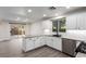 Bright kitchen featuring white cabinets, stainless steel appliances, and a subway tile backsplash at 9006 Cedar Door Ave, Las Vegas, NV 89148