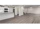 Open-concept layout featuring laminate flooring connecting the kitchen, dining, and living areas at 9006 Cedar Door Ave, Las Vegas, NV 89148