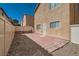Backyard features a patio area and low-maintenance desert landscaping for outdoor enjoyment at 9465 Milkweed Canyon Ave, Las Vegas, NV 89166