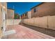Fenced backyard with a patio area and low-maintenance desert landscaping for outdoor enjoyment at 9465 Milkweed Canyon Ave, Las Vegas, NV 89166