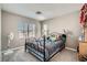 Cozy bedroom with plush carpeting, large window, and ample space at 9465 Milkweed Canyon Ave, Las Vegas, NV 89166