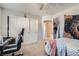 Cozy bedroom with a work space, large closet, and soft, inviting bedding at 9465 Milkweed Canyon Ave, Las Vegas, NV 89166