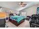 Comfortable bedroom featuring a ceiling fan and windows offering ample natural light at 9465 Milkweed Canyon Ave, Las Vegas, NV 89166