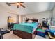 Comfortable bedroom featuring a ceiling fan and natural light, offering a cozy retreat at 9465 Milkweed Canyon Ave, Las Vegas, NV 89166