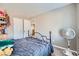 Comfortable bedroom with plush carpeting and large window, creating a relaxing atmosphere at 9465 Milkweed Canyon Ave, Las Vegas, NV 89166