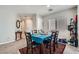 Bright dining area with a cozy rug, adjacent to the kitchen, offering an inviting space for Gathering meals at 9465 Milkweed Canyon Ave, Las Vegas, NV 89166
