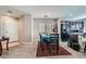 Welcoming dining area with a cozy rug, adjacent to the kitchen, offering an inviting space for Gathering meals at 9465 Milkweed Canyon Ave, Las Vegas, NV 89166