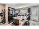 Well-equipped kitchen with stainless steel appliances and a convenient island with bar seating at 9465 Milkweed Canyon Ave, Las Vegas, NV 89166
