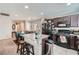 Charming kitchen features granite countertops, stainless appliances, and an open dining area at 9465 Milkweed Canyon Ave, Las Vegas, NV 89166