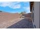 Private backyard featuring pavers, a cozy swing, and tall block wall that offers privacy at 9608 Bloodstone Ln, Las Vegas, NV 89143