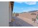 Backyard with brick pavers, wall, storage shed, and solar panels at 9608 Bloodstone Ln, Las Vegas, NV 89143