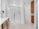 Bright bathroom featuring a walk-in shower with glass doors and a sleek vanity at 9608 Bloodstone Ln, Las Vegas, NV 89143