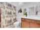 Bathroom with wood vanity and tree-themed shower curtain at 9608 Bloodstone Ln, Las Vegas, NV 89143
