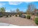 Inviting common area with mature landscaping and benches for relaxing at 9608 Bloodstone Ln, Las Vegas, NV 89143