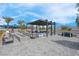 Stylish outdoor lounge area featuring comfortable seating, a fire pit, and scenic views at 9608 Bloodstone Ln, Las Vegas, NV 89143