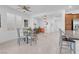 Bright dining area with a glass table adjacent to a home office and eat-in kitchen at 9608 Bloodstone Ln, Las Vegas, NV 89143