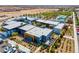 Aerial view of a modern apartment complex showcasing its contemporary architecture, parking, and landscaping at 9608 Bloodstone Ln, Las Vegas, NV 89143