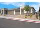 Charming single-story home featuring a three-car garage, desert landscaping, and solar panels at 9608 Bloodstone Ln, Las Vegas, NV 89143