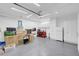 Oversized garage featuring storage, epoxy floor, and lighting at 9608 Bloodstone Ln, Las Vegas, NV 89143