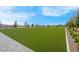 Lush green lawn complemented by neatly kept walkways and vibrant landscaping at 9608 Bloodstone Ln, Las Vegas, NV 89143
