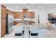 Modern kitchen featuring stainless steel appliances, granite countertops, and a large central island with seating at 9608 Bloodstone Ln, Las Vegas, NV 89143