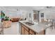 Open-concept kitchen with granite countertops, stainless steel appliances, and a seamless flow to the living area at 9608 Bloodstone Ln, Las Vegas, NV 89143