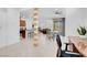 Open-concept living space with modern decor, tile flooring, and abundant natural light at 9608 Bloodstone Ln, Las Vegas, NV 89143