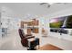 Open concept living space with kitchen, stainless steel appliances, dining area, and comfortable seating at 9608 Bloodstone Ln, Las Vegas, NV 89143