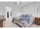 Bright main bedroom featuring a comfortable bed, decorative wall trim, and modern furnishings at 9608 Bloodstone Ln, Las Vegas, NV 89143