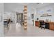 Bright and open office area featuring tile flooring and a decorative structural column at 9608 Bloodstone Ln, Las Vegas, NV 89143