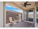 Inviting outdoor patio with ceiling fan and brick-paved flooring at 9608 Bloodstone Ln, Las Vegas, NV 89143
