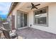 Outdoor patio featuring a ceiling fan, tiled floor, and seating at 9608 Bloodstone Ln, Las Vegas, NV 89143