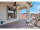 Covered patio with brick flooring, seating area, and ceiling fans at 9608 Bloodstone Ln, Las Vegas, NV 89143