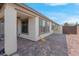 Spacious patio featuring brick pavers, and a storage shed, perfect for outdoor living at 9608 Bloodstone Ln, Las Vegas, NV 89143